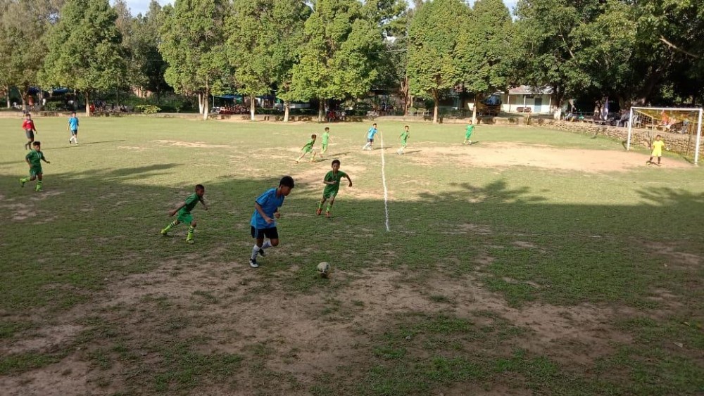 The game between Charis High Academy (Blue) and Community Education Centre School at the Greenwood School ground on June 20. (Morung Photo)